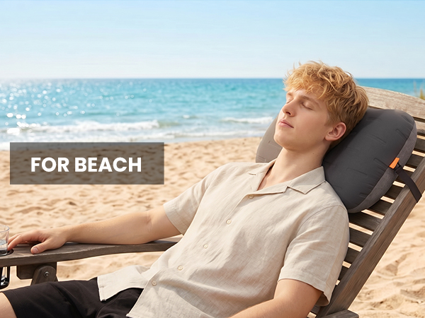 Beach pillow providing neck support on a lounge chair by the ocean.