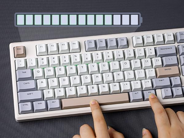 a person's hands on a keyboard.
