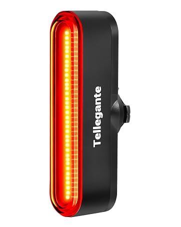 Text reads 'Tailgnite'. Black rectangular rear bike light with bright red LED illumination panel. Red warning light with control button, designed for bicycle safety.