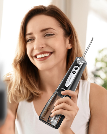 Handheld water flosser