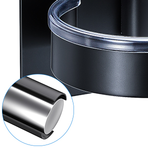 Close-up of a cylindrical object with a transparent cover and metallic base or interior. Partial view suggests it may be part of a larger device.