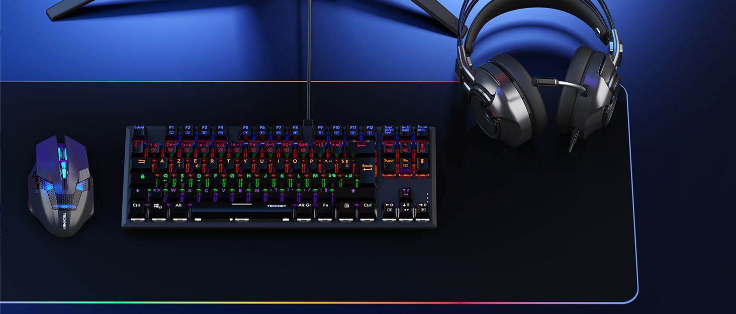 a keyboard and headphones on a desk