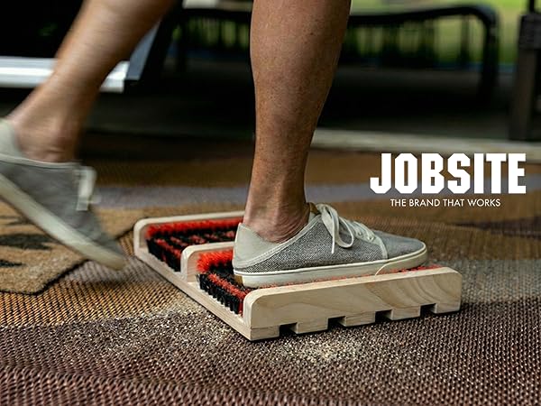 Close up of jobsite shoe brush flat scrubber in use in front of RV