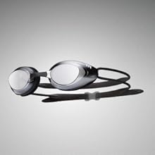 Image of swim goggles with text reading unibody construction.