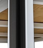 Close-up detail of black and white vertical striped architectural element, possibly a column or divider, against wooden flooring background.