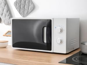 a micro-wave oven idicating a usage scenario of remote control outlet plug