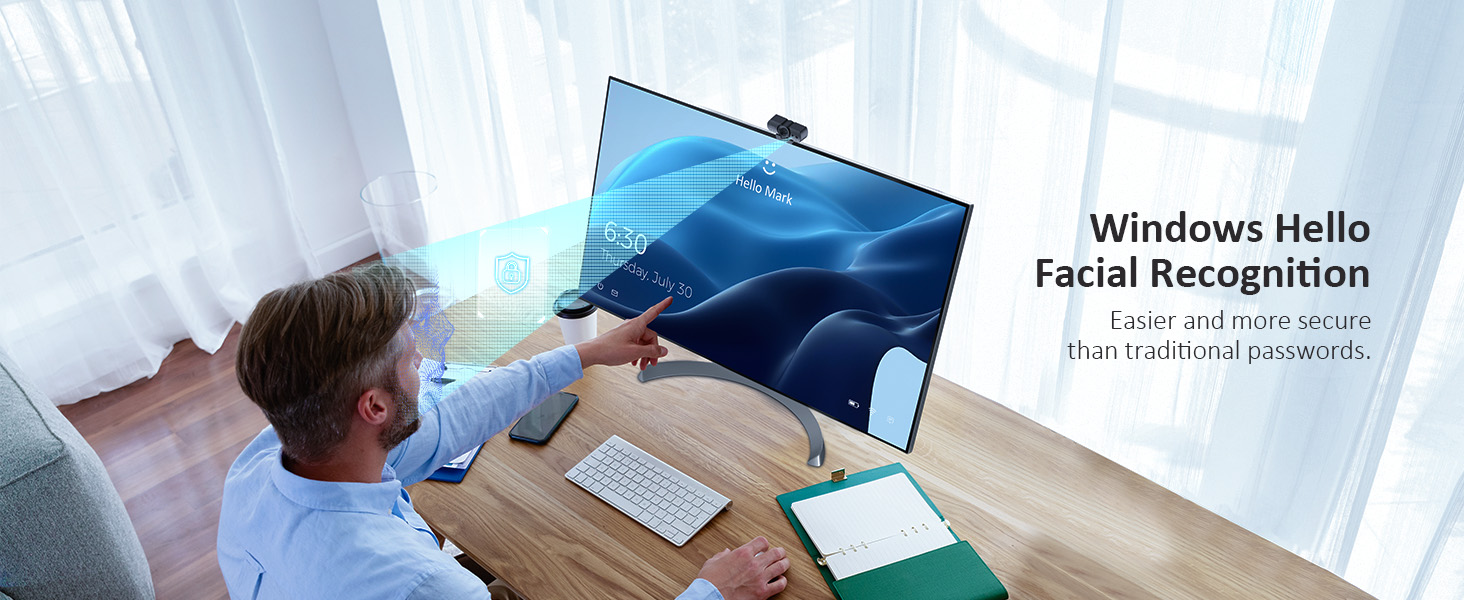 A man is using Windows Hello facial recognition to unlock his computer