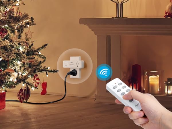 a hand using remote control light switch for holiday Christmas decoration