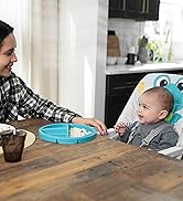 baby in high chair at dining table