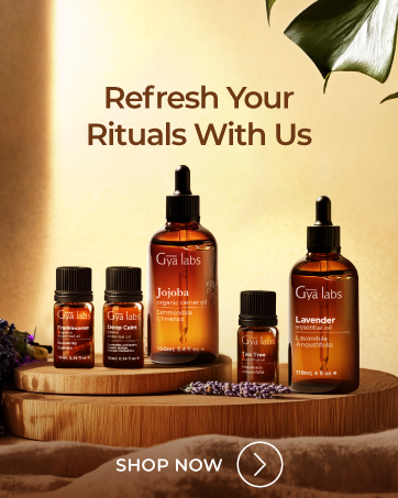 Text reads 'Refresh Your Rituals With Us' and 'SHOP NOW'. Product display of amber glass bottles with skincare products on wooden surface with warm lighting.