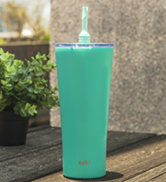 30 oz tropic Zak Designs stainless steel tumbler with silicone straw on outdoor deck