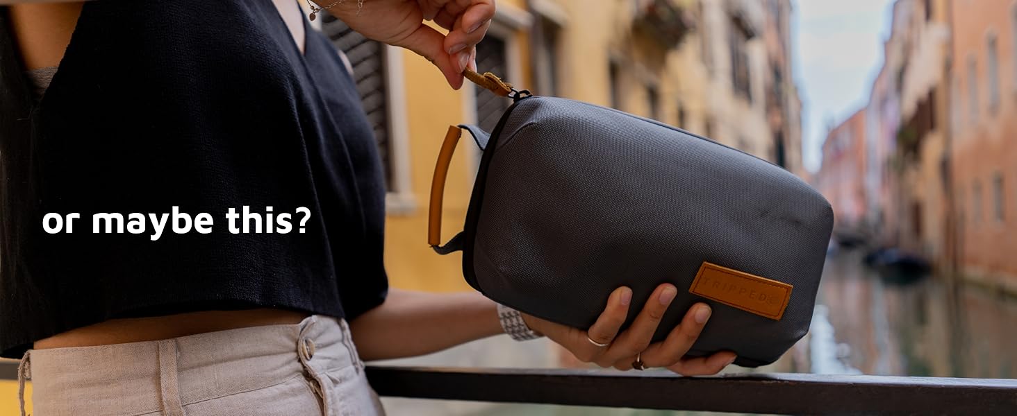 girl holding a camera travel organizer bag in venice italy