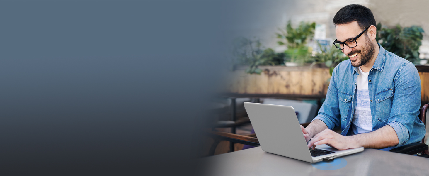 A Man Enjoys Fast WiFi on His Laptop PC with This AX900 Dual Band USB WiFi 6 Adapter