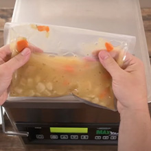 LEM MaxVac Pro Chamber vacuum sealer bag with liquid inside