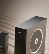 Sequence showing black wireless speaker with curved gold or brass accent line forming a smile shape, displayed from multiple angles.