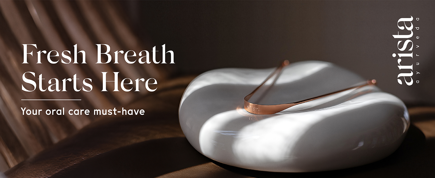 Arista’s copper tongue scraper on white natural stone
