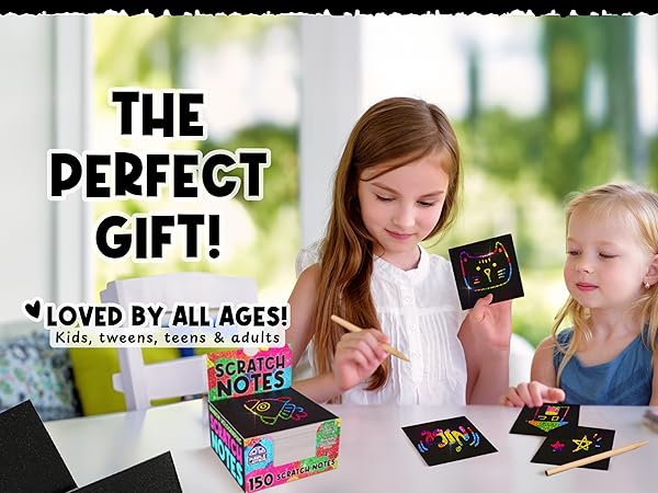 A family bonding over rainbow holographic scratch notes, crafting fun memories side by side