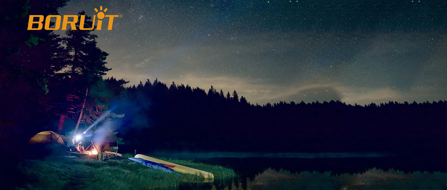 Nighttime forest scene with illuminated tent and bright flashlight beam. Boruit logo visible in top-left corner.