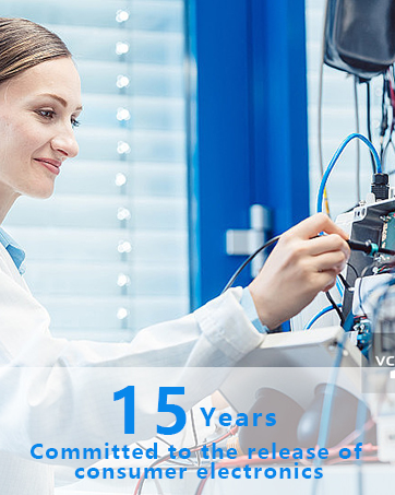 Technician in white lab coat working on electronic equipment. Text overlay: '15 Years Committed to the release of consumer electronics'.