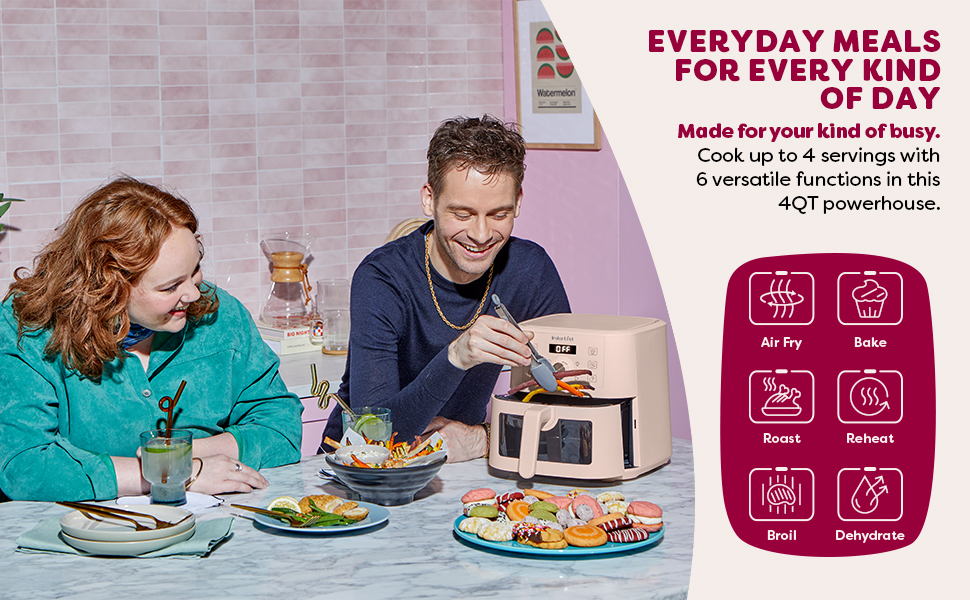 happy couple having fun cooking in the air fryer, with desserts on a platter
