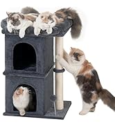 Two-tier grey cat tower with scratching post and cave-like enclosure. Multiple cats interacting with the structure, including resting on top and climbing.