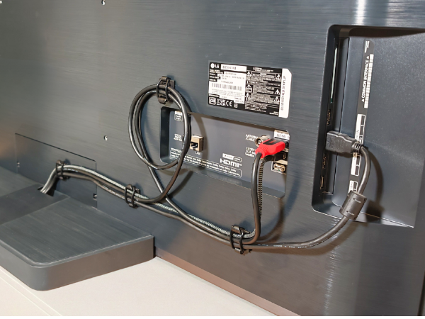 Cables secured behind TV.