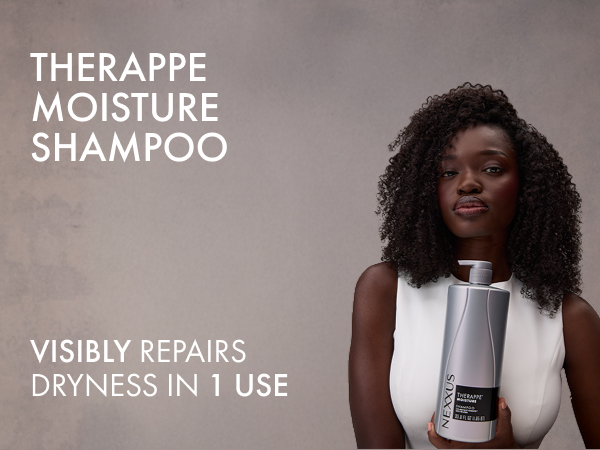 Young woman with healthy curly dark hair holding a Nexxus Therappe Moisture Shampoo bottle.