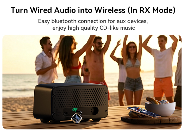 Text reads 'Turn Wired Audio into Wireless (in RX Mode)', 'Easy bluetooth connection for aux devices, enjoy high quality CD-like music'. Portable black Bluetooth speaker on beach with group of people dancing in background.