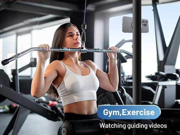 use the phone ring holder to attach on the metal section in the gym to watch guiding videos