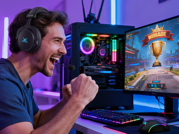 Gaming setup showing illuminated RGB gaming peripherals and monitor displaying game interface with trophy icon. RGB lighting visible on keyboard and computer case.