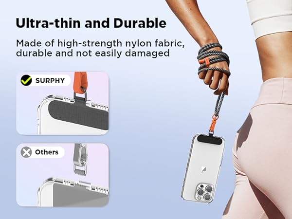 Ultra-thin, durable phone strap made of high-strength nylon fabric. Comparison shows product's slim profile against competitor. Hand demonstrates strap supporting smartphone weight.