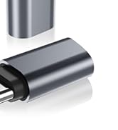 Multiple angles of a metallic gray USB-C style connector or adapter, showing port end and cylindrical body construction.