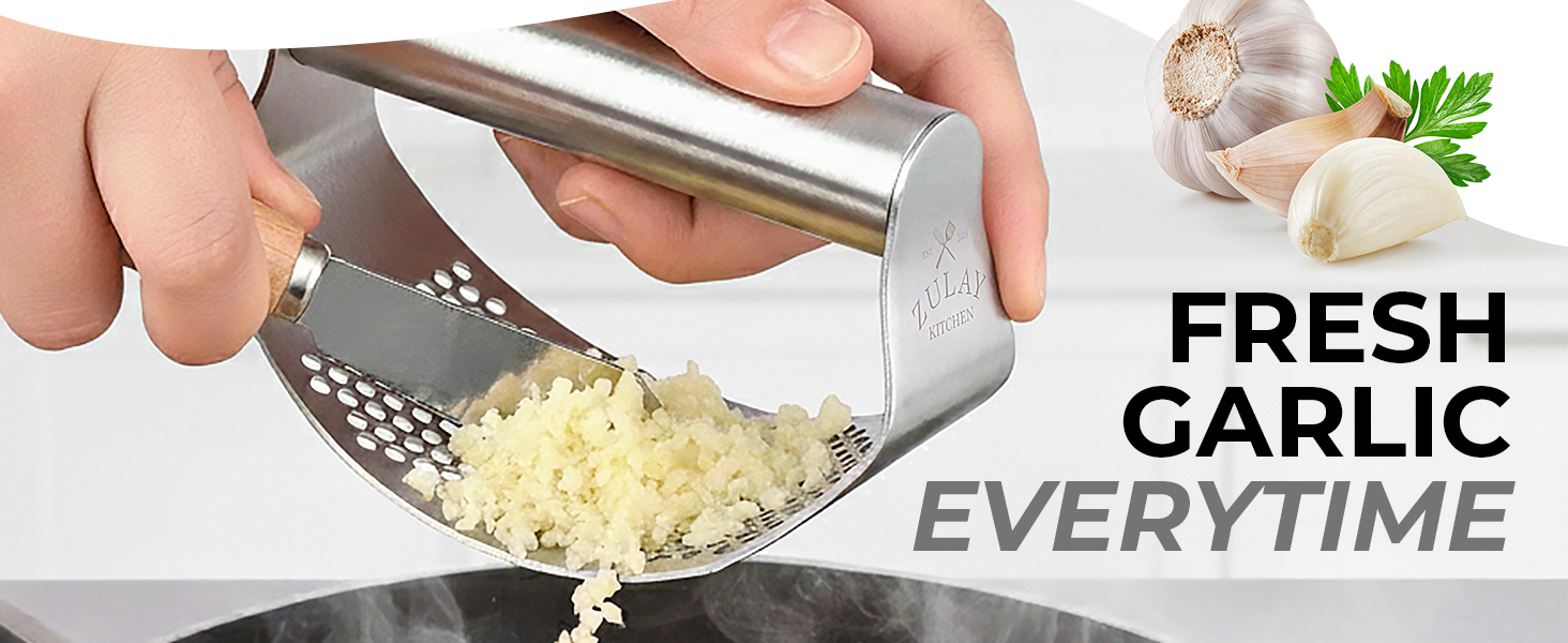 Manual garlic crusher rocker with stainless steel design for quick garlic mincing.