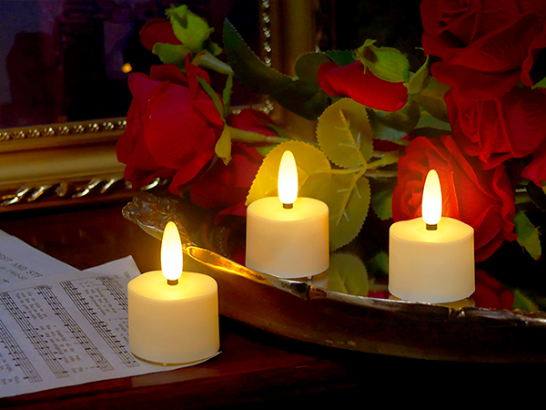 3 rechargeable tea lights with some artifical flowers rose