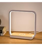 Modern table lamp with square LED frame and wooden base. Features integrated wireless charging pad. Emits warm light in minimalist design.