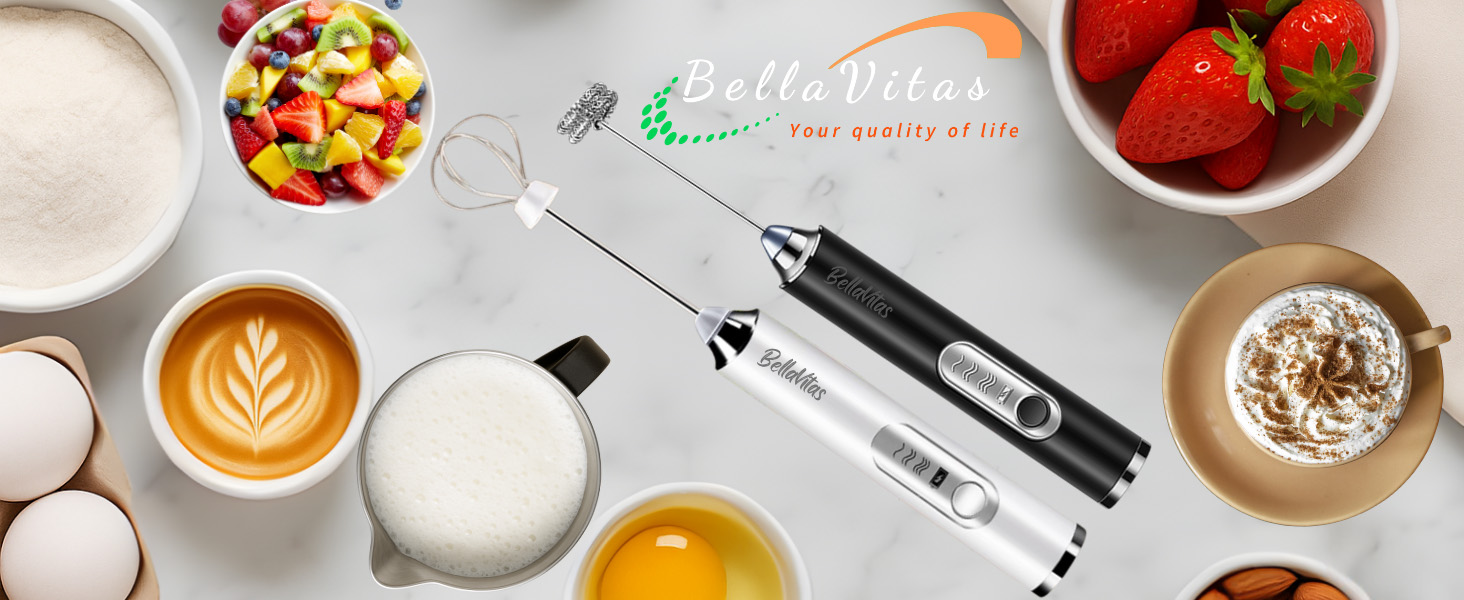 Black and white milk frothers with whisks on marble counter with coffee, milk, eggs, fruit