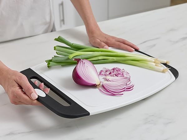 Cutting board with non-slip rubber handles