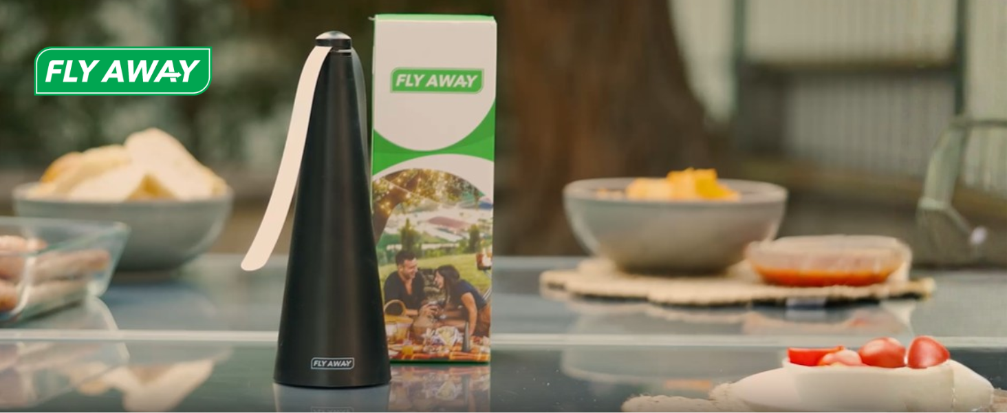 Fly Away fly fan on outdoor dining table providing quiet chemical-free fly protection during meals.
