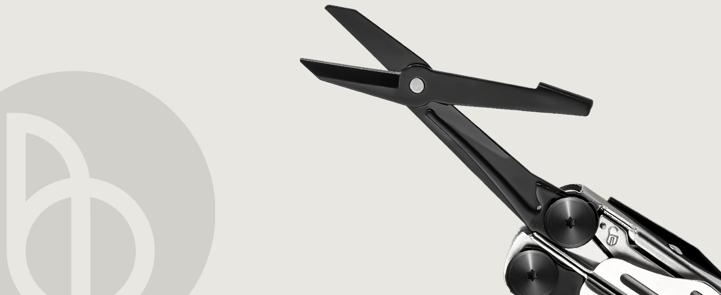 Close-up of black professional scissors against light background, showing detailed pivot joint and blade design.