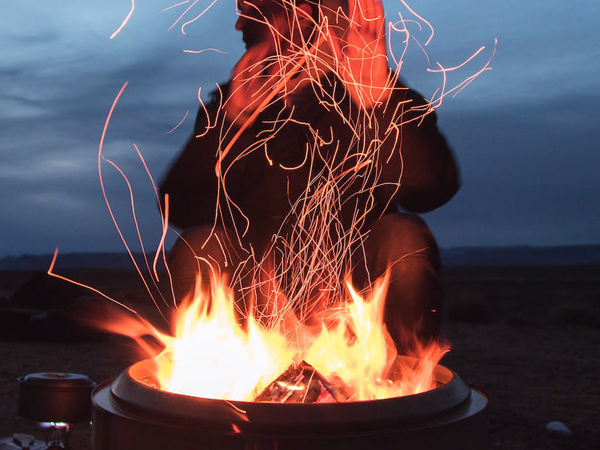 Blowing camping fire