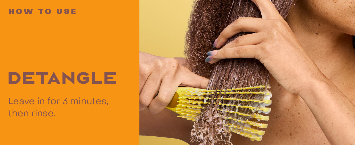 Image of a comb detangling hair.