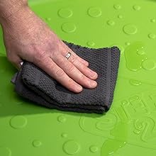 Close up of cloth wiping surface of Splash Pad