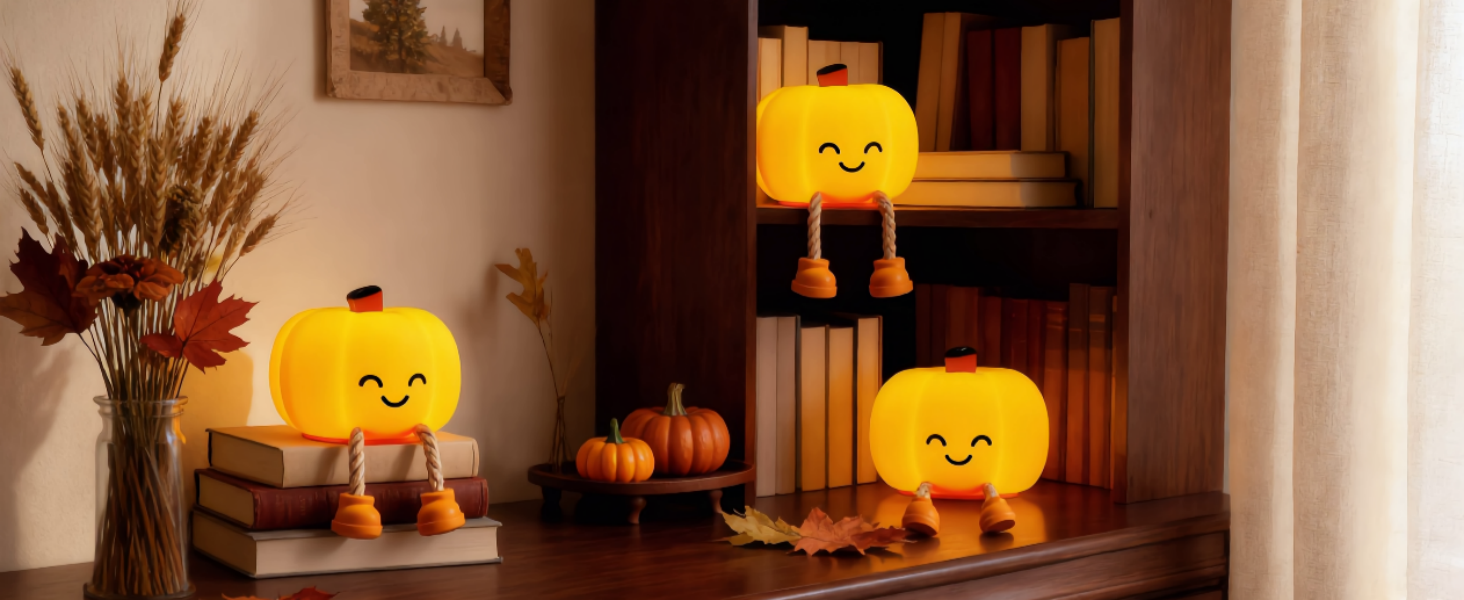 Pumpkin night lights on the bookshelf