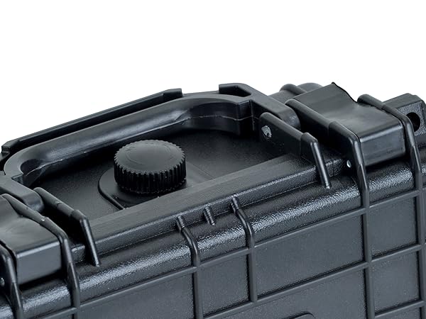 Close-up of a black, rugged protective case with textured exterior and secure latches. Partial view showing top corner details.
