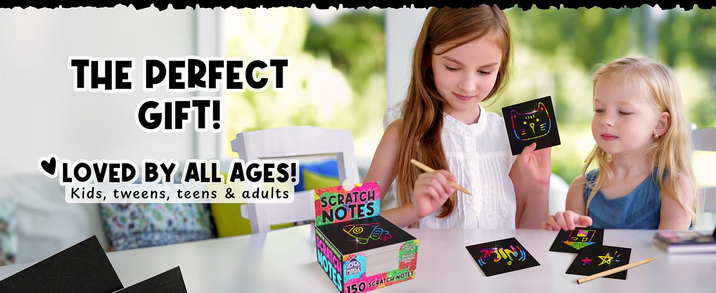 A family bonding over rainbow holographic scratch notes, crafting fun memories side by side