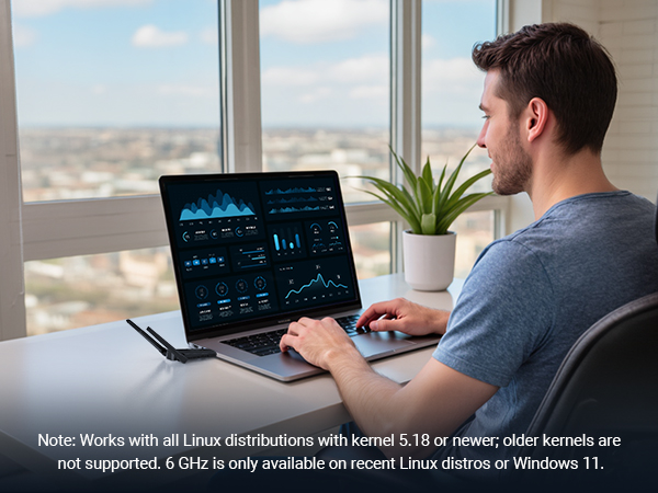 A Man is Using a Laptop with the Linux Compatible WiFi 6E USB Adapter Plugged in