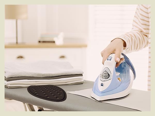 A woman using the iron rest pad