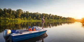 A fisherman stands in the boat