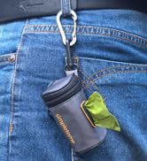 a water bottle holder attached to a pair of jeans.