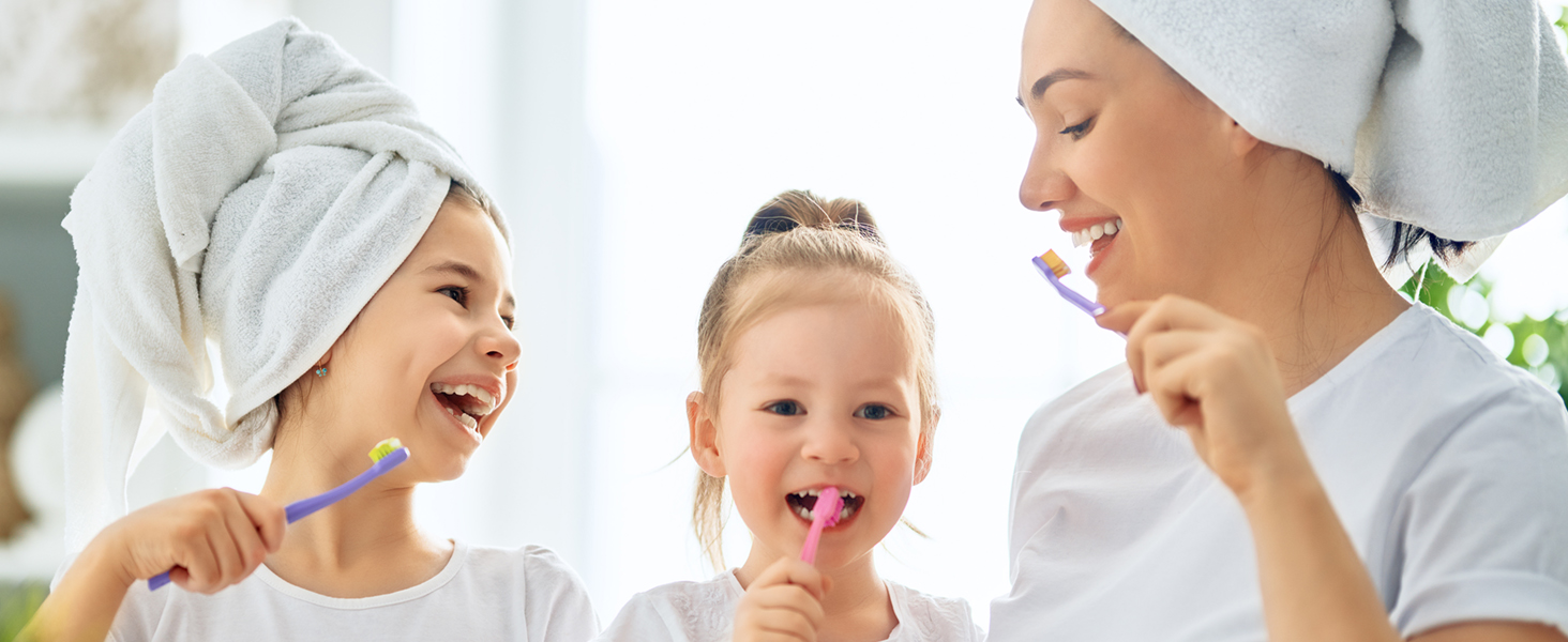 family brushing teeth